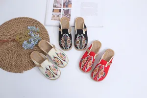Handmade ethnic embroidered slippers with woven linen soles in three vibrant colors