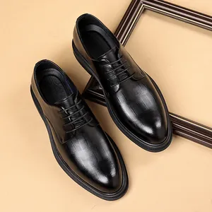 Classic elegant black men's business dress shoes with lace-up style and textured leather