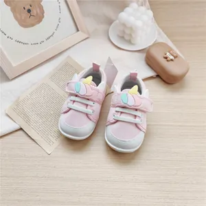 Detailed view of pink baby walking shoes with cute unicorn design and soft soles