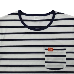 Detail view of a men's navy striped t-shirt with a chest pocket and orange label