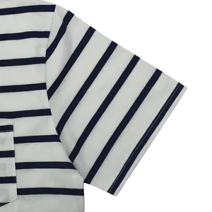 Close-up detail of navy striped sleeve and pocket stitching on white men's cotton T-shirt