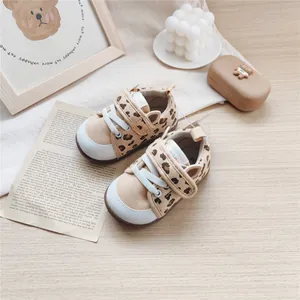 Detailed view of leopard print baby toddler shoes with cute cat ear design and soft sole