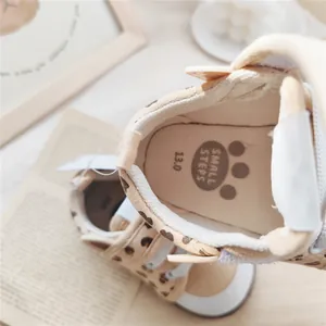Detailed macro view showing the soft padded insole of leopard print baby toddler shoes