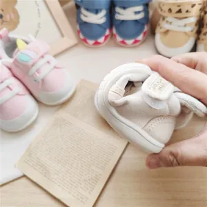 Close-up showing the extreme flexibility of these soft-sole baby walking shoes.