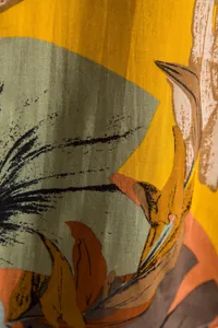 Macro detail of tropical floral print fabric for men's summer Hawaiian beach shirt