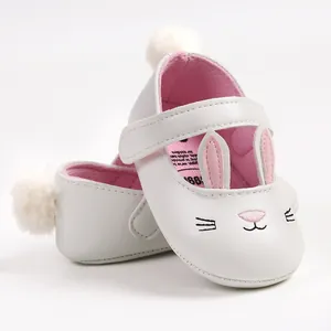 Comfortable soft sole baby walking shoes with cute white bunny design and fluffy pom-pom heel