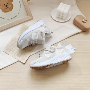 Macro detail of MLW beige kids functional sneakers with mesh panels and velcro straps