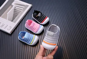 Macro detail of multi-color breathable fly-knit walking shoes for baby boys and girls