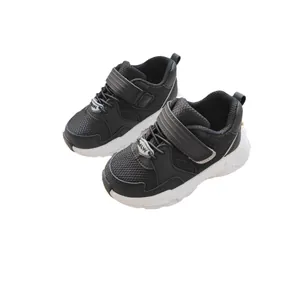Black and white kids functional sneakers with breathable mesh upper and velcro strap