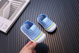 Detail of blue breathable fly-knit baby walking shoes with slip-on design