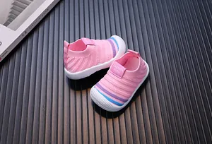 Top view detail of pink breathable fly-knit walking shoes for toddlers and babies