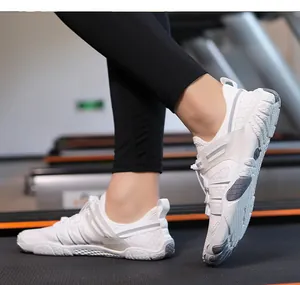 Detailed side view of white breathable wading shoes on a treadmill showing soft sole grip