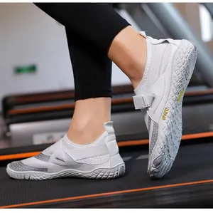 Close-up of white breathable water shoes with non-slip sole on treadmill