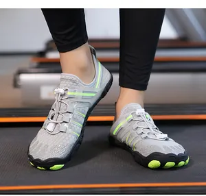 Detail view of grey barefoot water shoes on a treadmill for fitness workouts