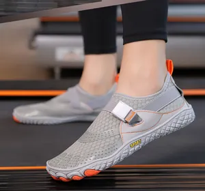 Close-up of breathable five-finger water shoes on a treadmill for fitness and sports