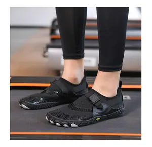 Detailed view of black breathable five-finger barefoot shoes for gym and water sports