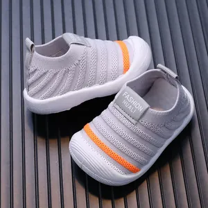Breathable flyknit baby walking shoes in grey with orange accent stripe for toddlers