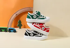 Stacked colorful children's canvas sneakers in green, red, and black for toddlers.