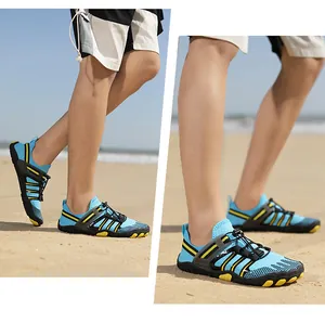 Action shot of breathable blue water shoes with quick-dry mesh on a sandy beach.