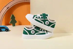 Green canvas toddler shoes with soft soles and velcro straps for boys and girls.