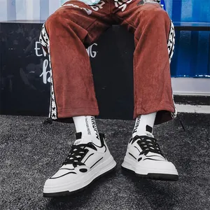 Hip-hop style men's white sneakers with black accents for casual streetwear look