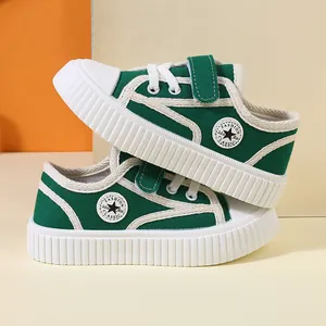 Vibrant green children's canvas sneakers with soft soles and adjustable velcro straps