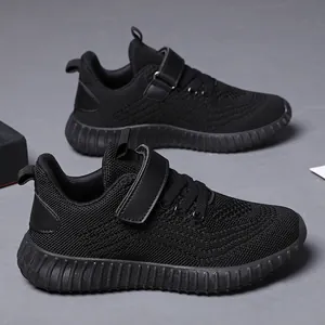 Breathable black mesh sneakers for kids with Velcro straps and thick rubber soles