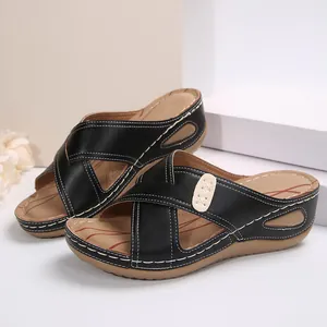 Vintage black wedge sandals for women with elegant white contrast stitching design.