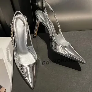 Elegant silver metallic slingback pumps with pointed toe and delicate chain strap details.