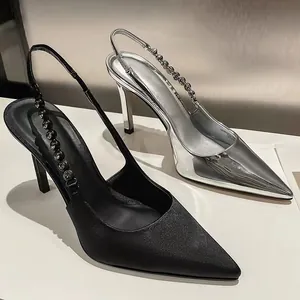 Elegant pointed-toe slingback heels with decorative rhinestone chain in silver and black