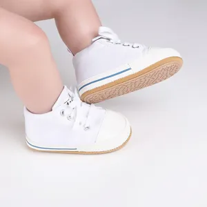 Detailed view of white baby walking shoes with durable non-slip rubber soles
