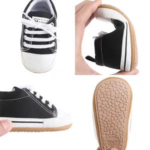 Detailed view of flexible rubber sole and anti-slip texture on baby canvas pre-walker shoes.