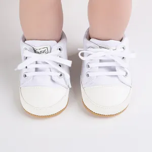Macro view of premium white canvas baby walking shoes for infants aged 0-1 year