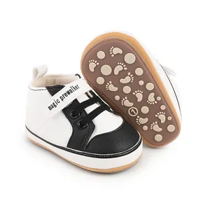 Detail view of black and white baby walking shoes for 0-1 year olds with anti-slip soles