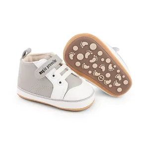 Close-up view of grey and white baby prewalker shoes featuring anti-slip rubber soles
