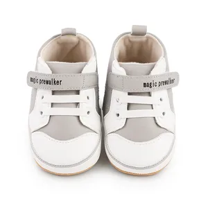 Front view detail of gray and white baby prewalker shoes for infants aged 0-1 year