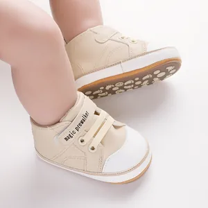 Beige infant pre-walker shoes featuring velcro straps and anti-slip footprint soles