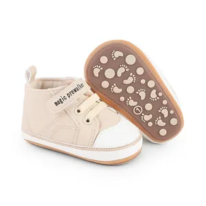 Detailed view of beige baby pre-walker shoes featuring non-slip patterned rubber soles