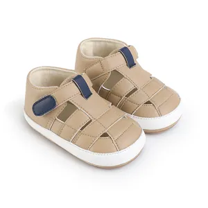 Beige Baby-Sandalen für den Sommer mit blauem Klettverschluss und weißen Sohlen