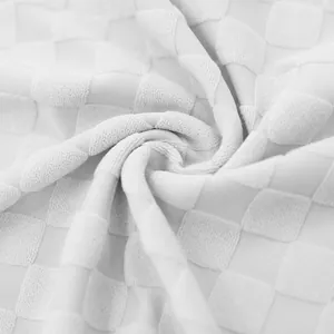 Close-up of white heavyweight checkerboard jacquard fabric for men's casual shorts