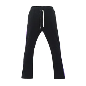 Front view of black flared track pants featuring purple side stripes and drawstrings.
