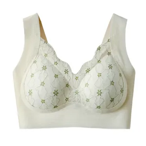 Seamless lace bralette with green floral embroidery and fixed cups for daily comfort.