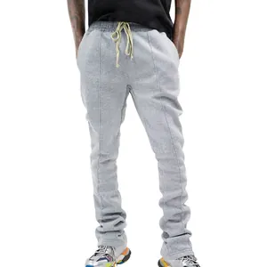 Close-up of grey stacked joggers for men with drawstring waist and paneled design