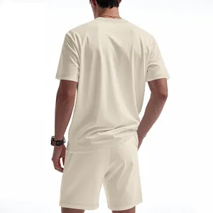 Back view of a male model wearing a men's loose waffle knit summer t-shirt and shorts set
