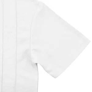 Close-up detail of white waffle knit fabric on men's short sleeve crewneck summer top
