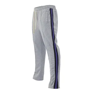 Men's grey flared joggers featuring purple and black side stripes and drawstring waist.