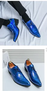 Detailed view of electric blue paisley patent leather men's pointed-toe elevated dress shoes