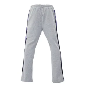 Detailed back view of grey flared sweatpants for men featuring purple side stripes