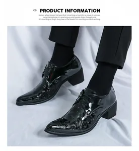 Detailed view of men's pointed toe patent leather dress shoes with paisley pattern
