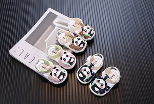 Close-up of toddler sandals with panda cartoon and soft soles in multiple colors